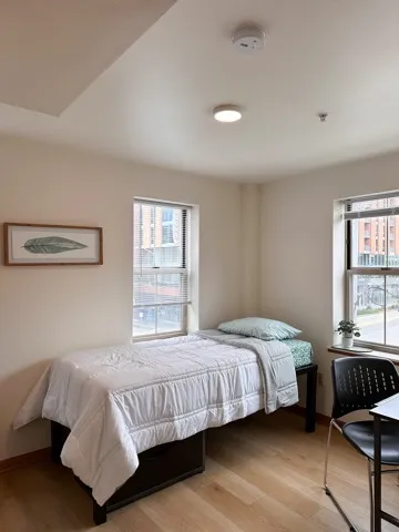 Bedroom-Model Unit pictured is twin bed included in every unit and desk perfect for students attending uw madison wi