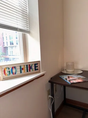 Go hike sign sitting on windowstill at Varsity Campus Apartments