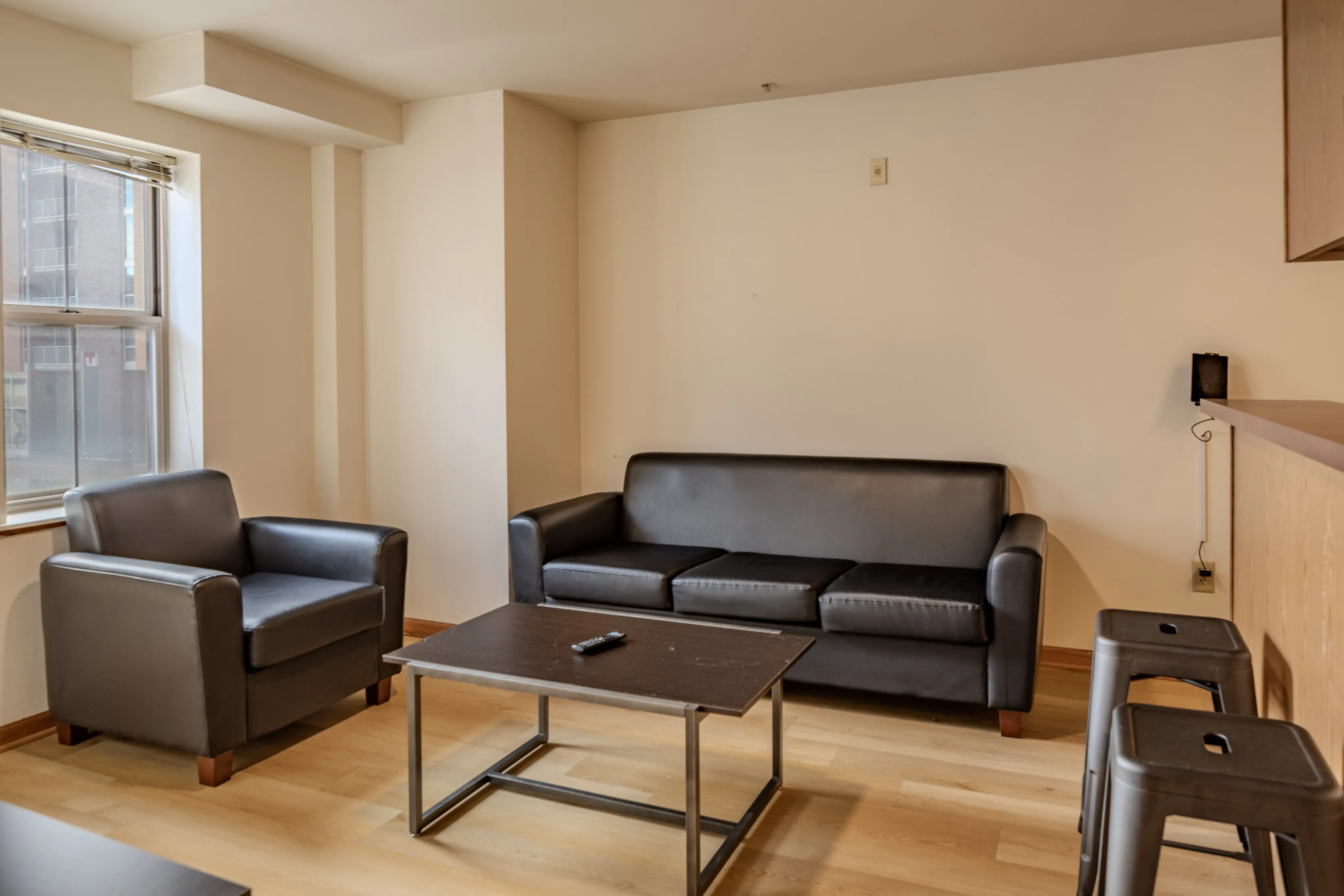 Inviting living room space with couch, TV, and coffee table
