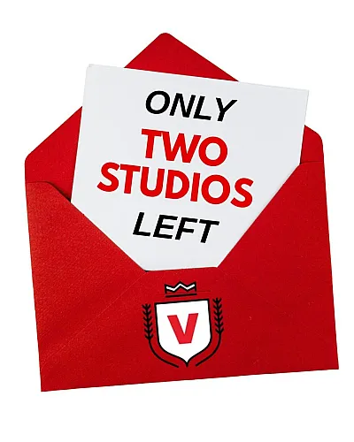 Eye-catching red envelope revealing a card that announces 'Only Two Studios Left,' emphasizing urgency for upscale living opportunities.