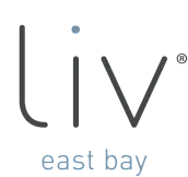 Minimalist logo featuring 'liv east bay' in sleek typography with a modern dot design.