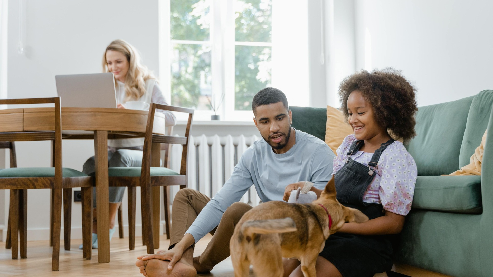 Family in living room with dog
