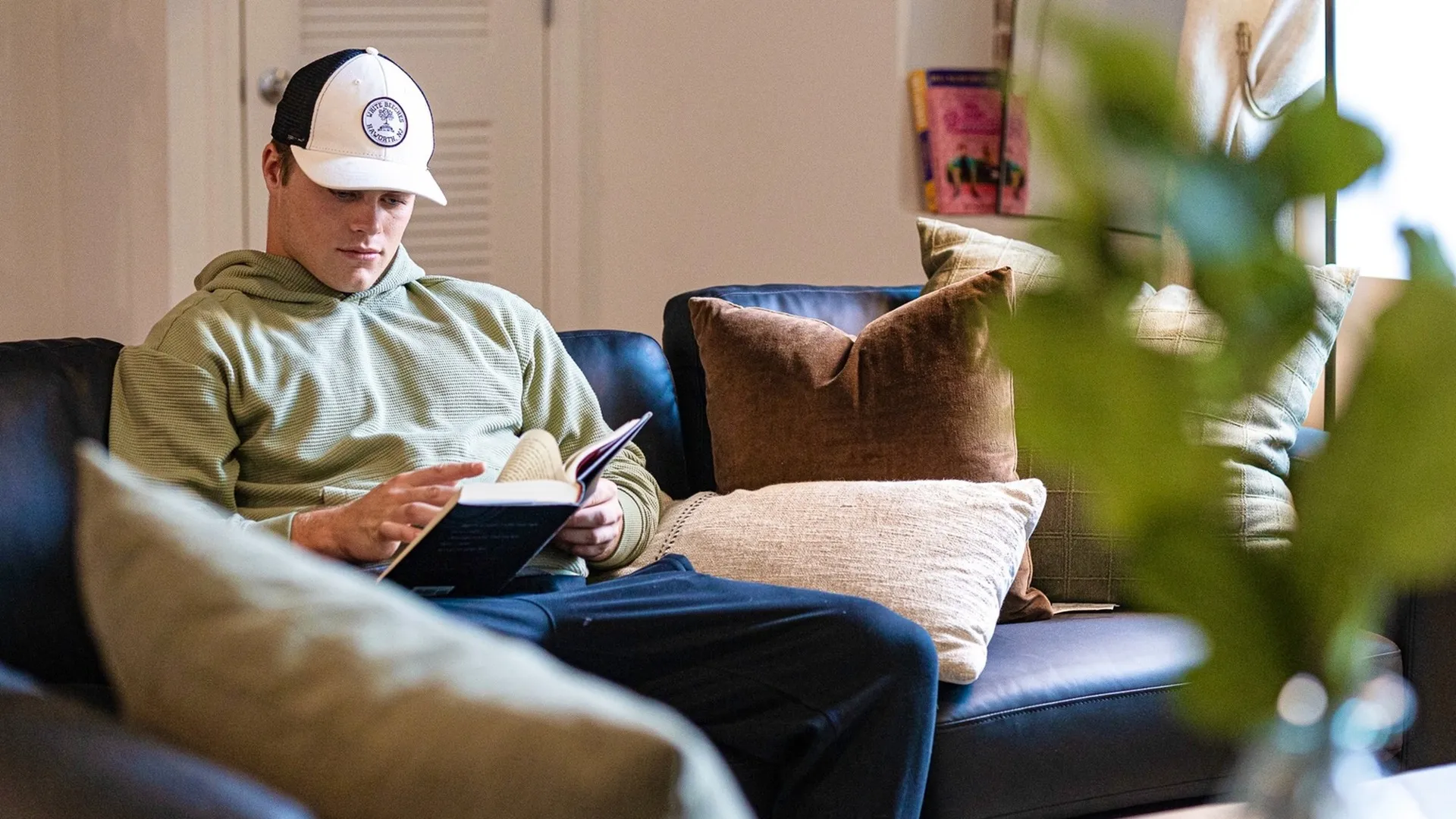 Student reading in the living room