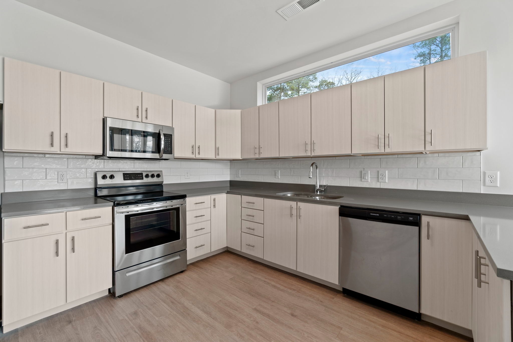 Kitchen with stainless appliances and white cabinets