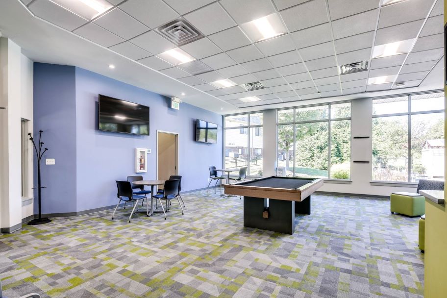 Clubhouse featuring cozy seating and vibrant decor in Butler Ridge Apartments.