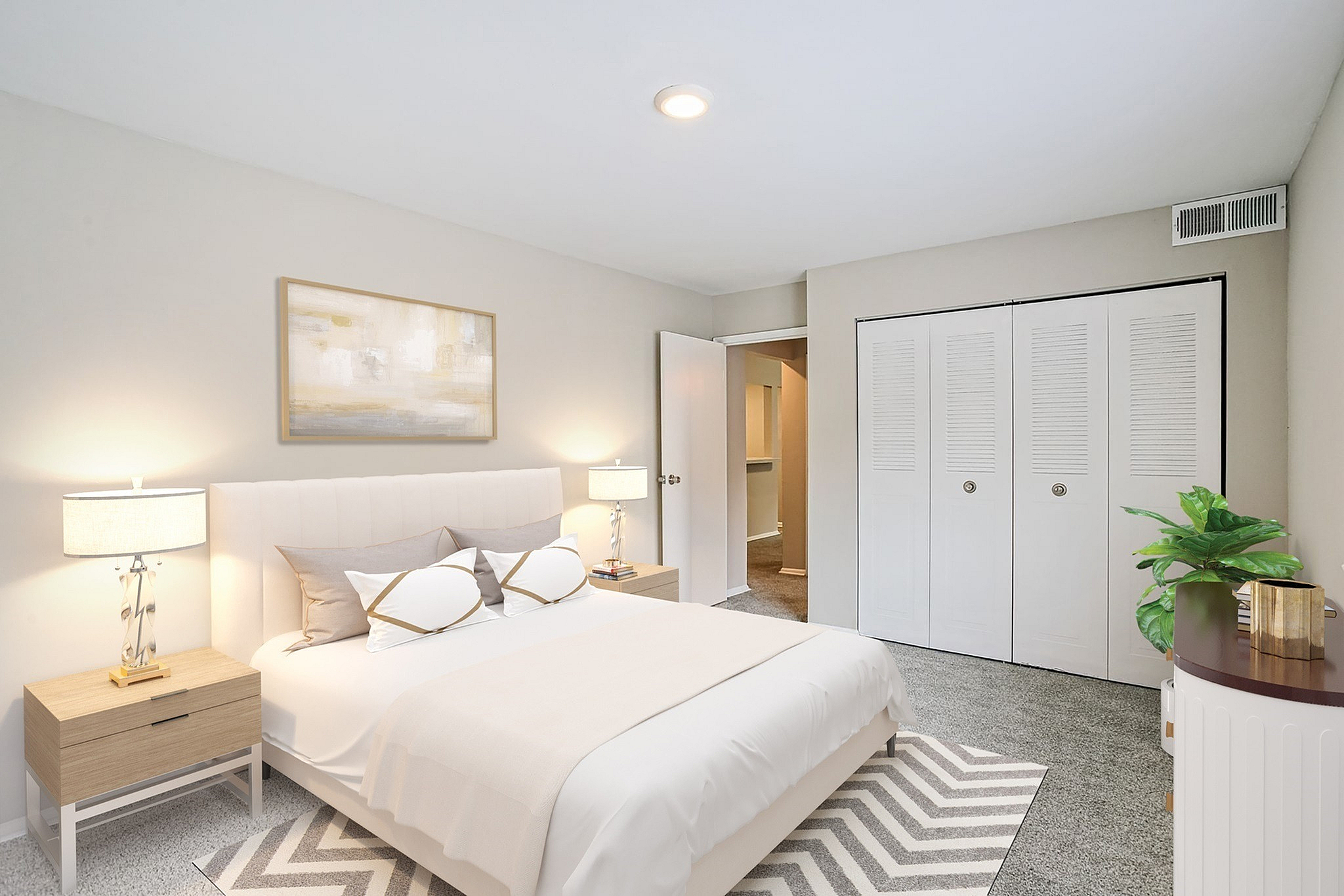 Elegant bedroom with a cozy bed, modern nightstands, and stylish decor, offering a peaceful retreat with abundant natural light.