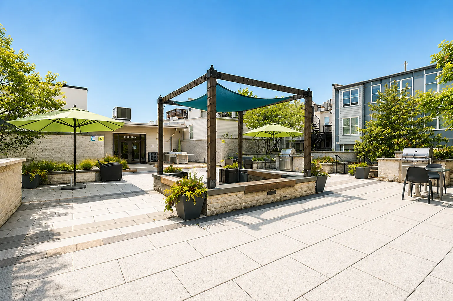 Inviting outdoor courtyard with stylish pergola, lush greenery, modern seating, and barbecue grills for delightful gatherings.
