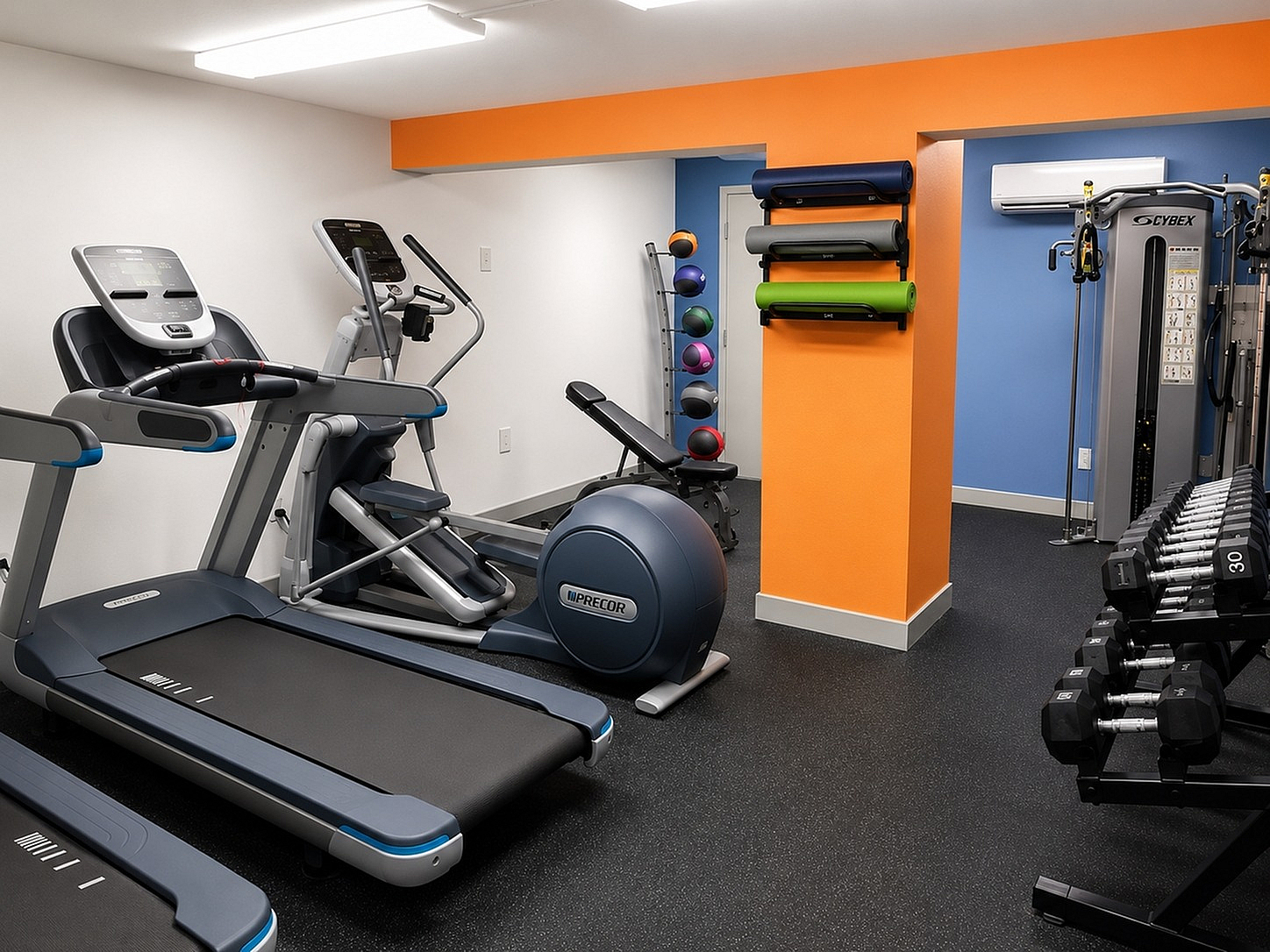 Modern apartment gym with state-of-the-art equipment, vibrant decor, and diverse workout options.