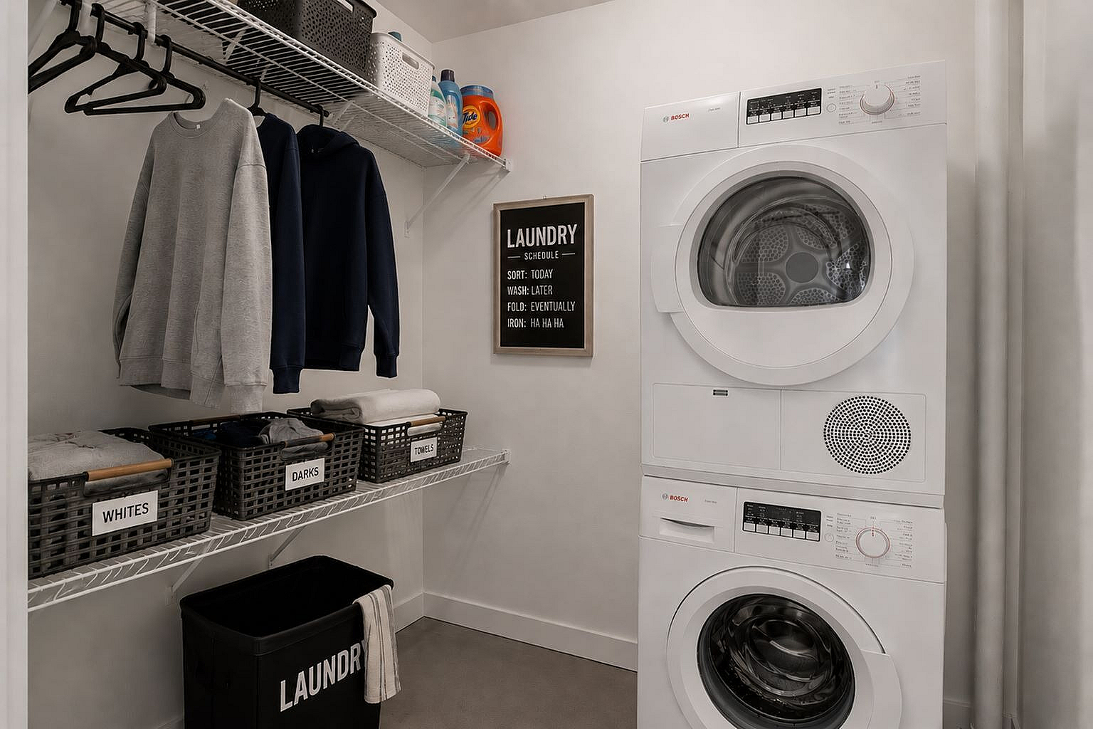Modern laundry room with efficient stacked washer and dryer, organized shelving, and clear sorting baskets for easy laundry management.