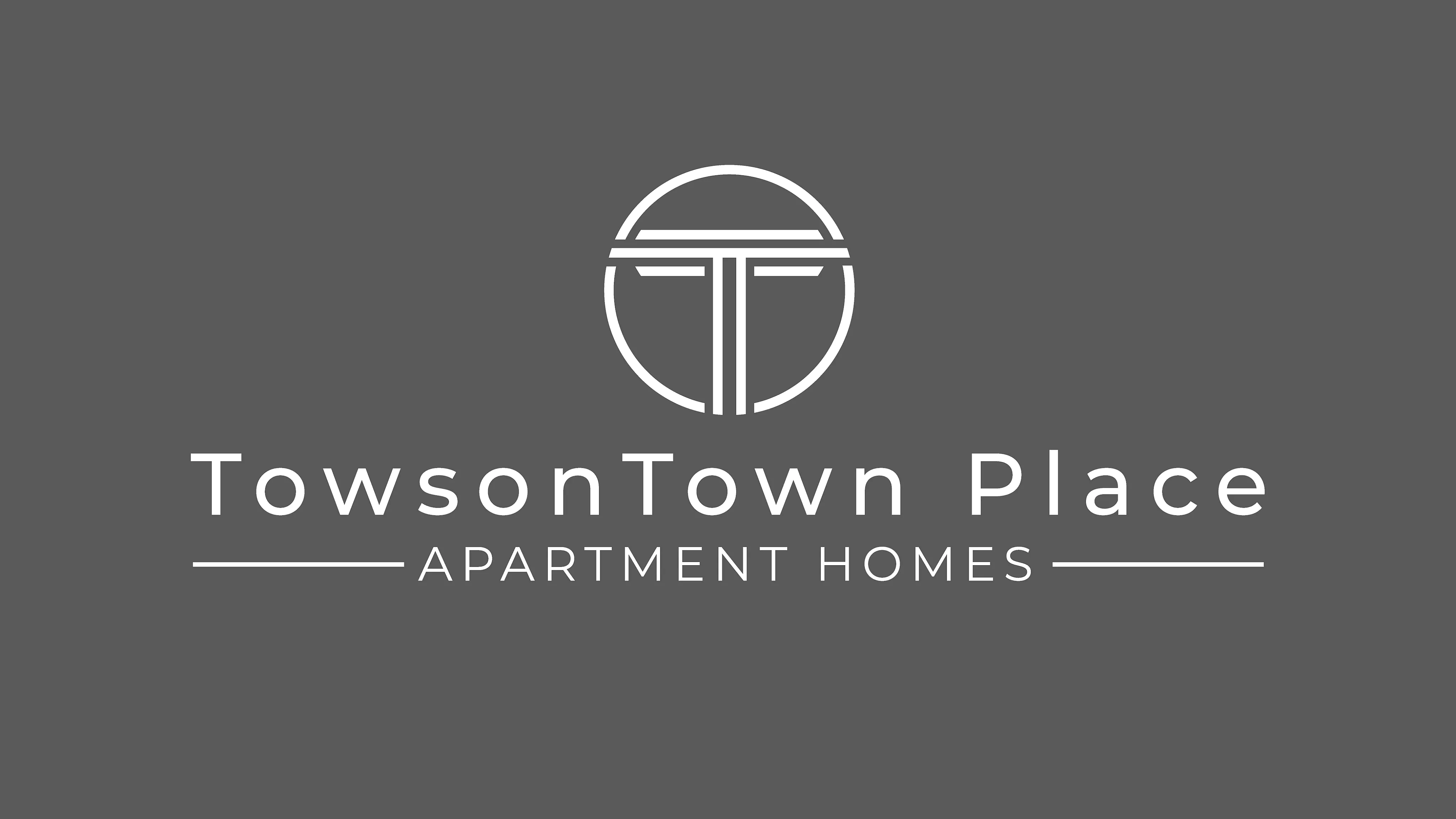 Logo of TowsonTown Place Apartment Homes with a gray background.