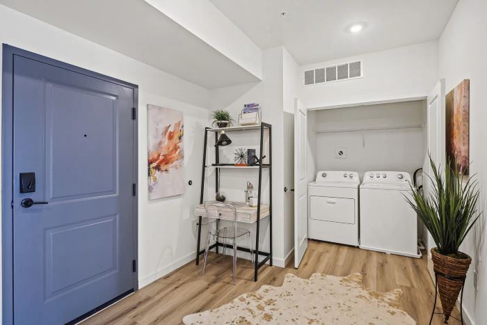 Laundry room with washer and dryer at Emerson Flats.
