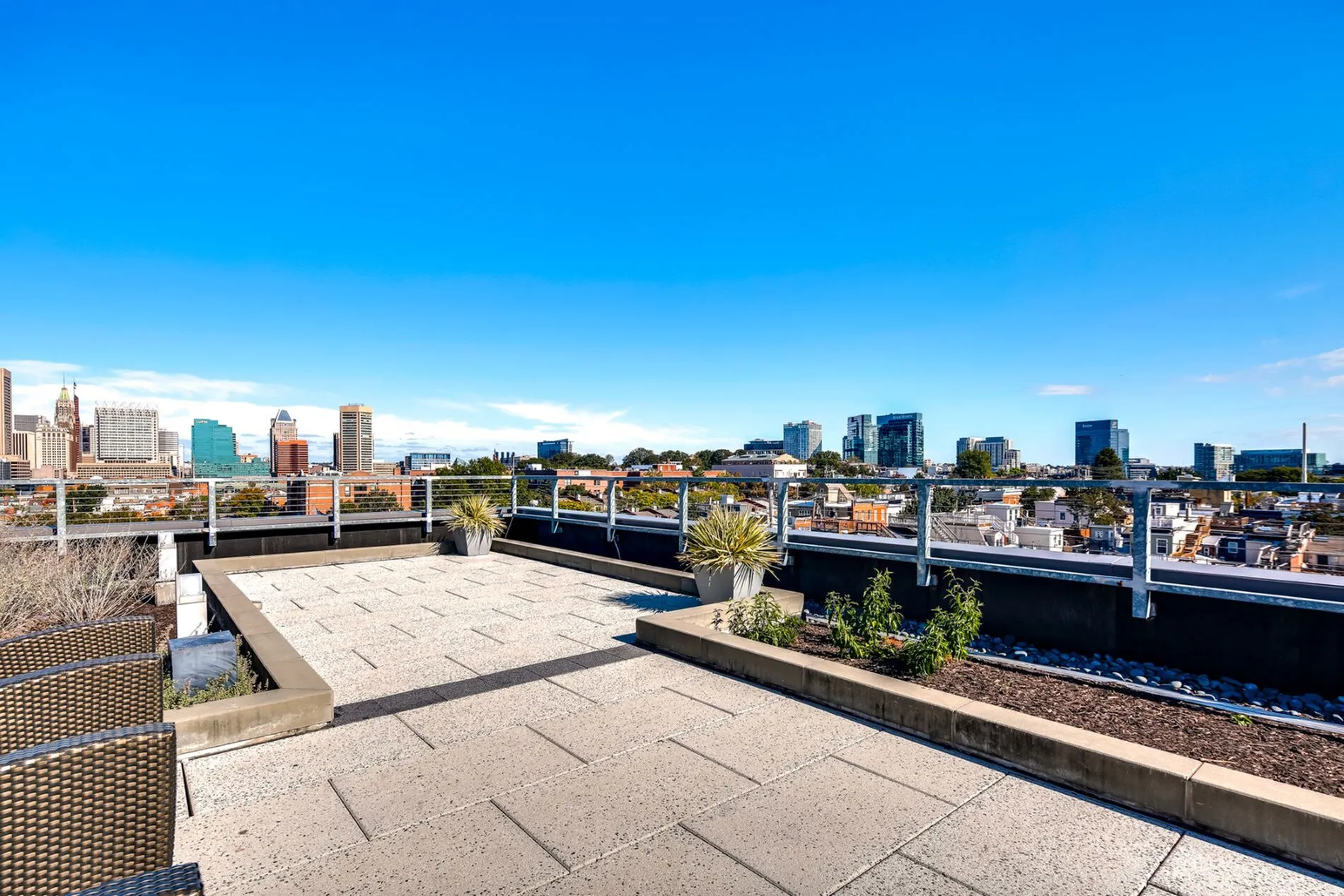 Stunning rooftop terrace offering expansive city skyline views, perfect for relaxation and entertainment.