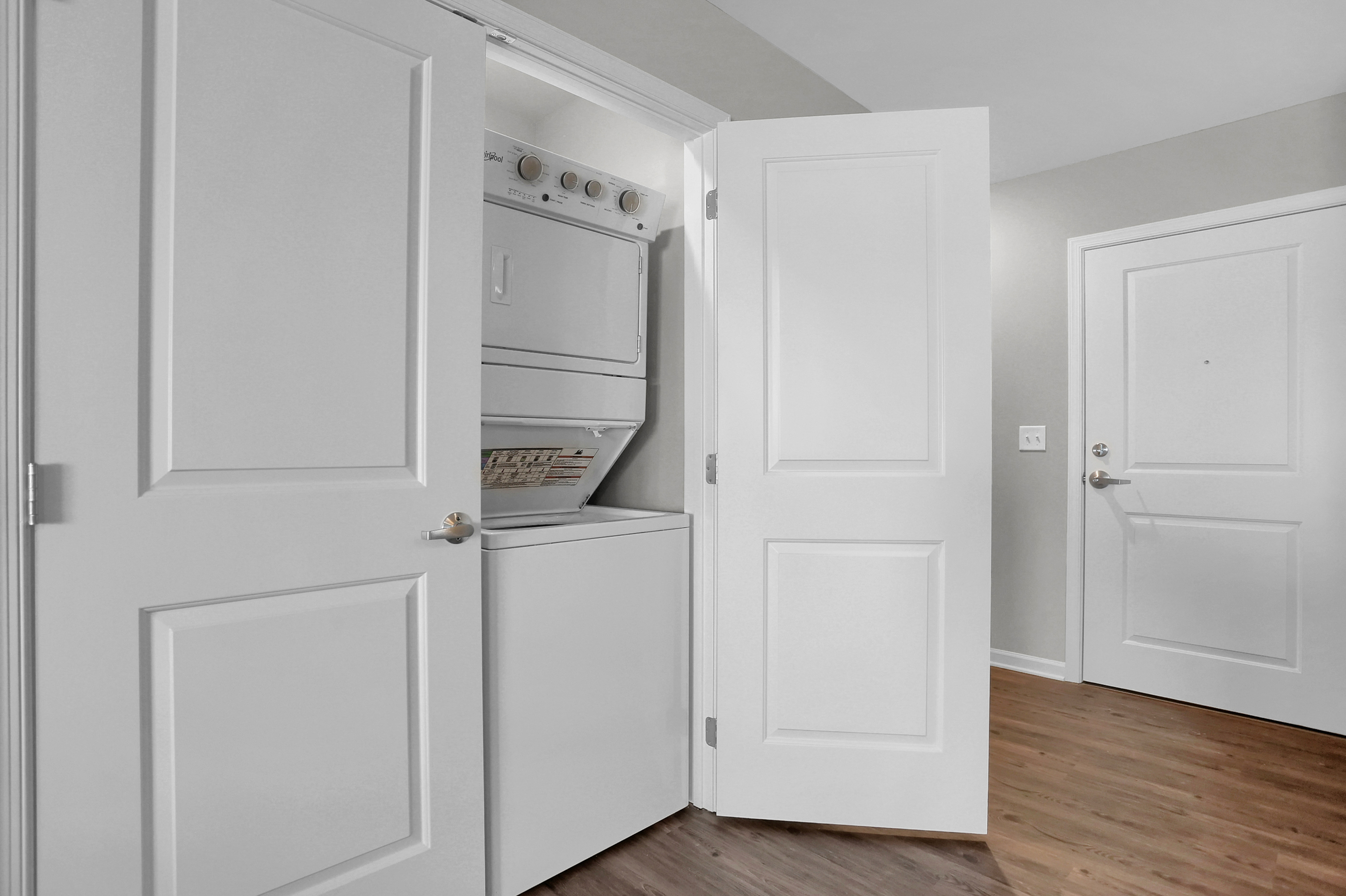 Bright apartment with a stylish in-unit stacked washer and dryer, enhancing convenience and modern living.