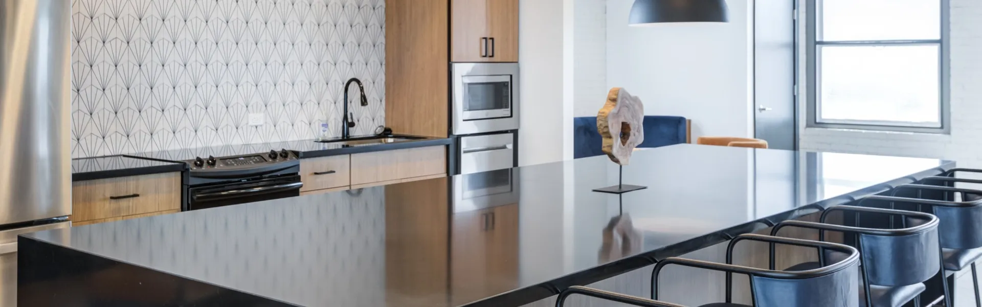 Gourmet kitchen in the clubhouse with island seating.
