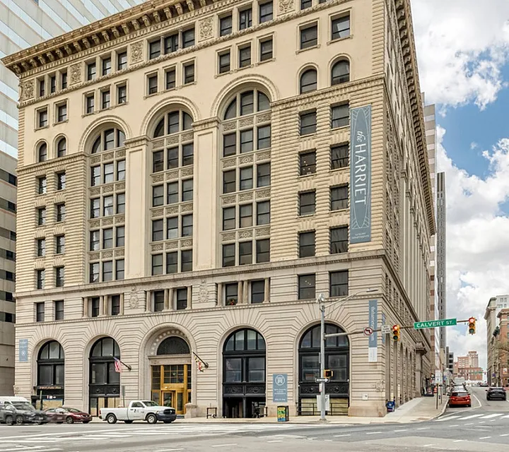 Stunning historic building with detailed classic architecture on a bustling city corner.