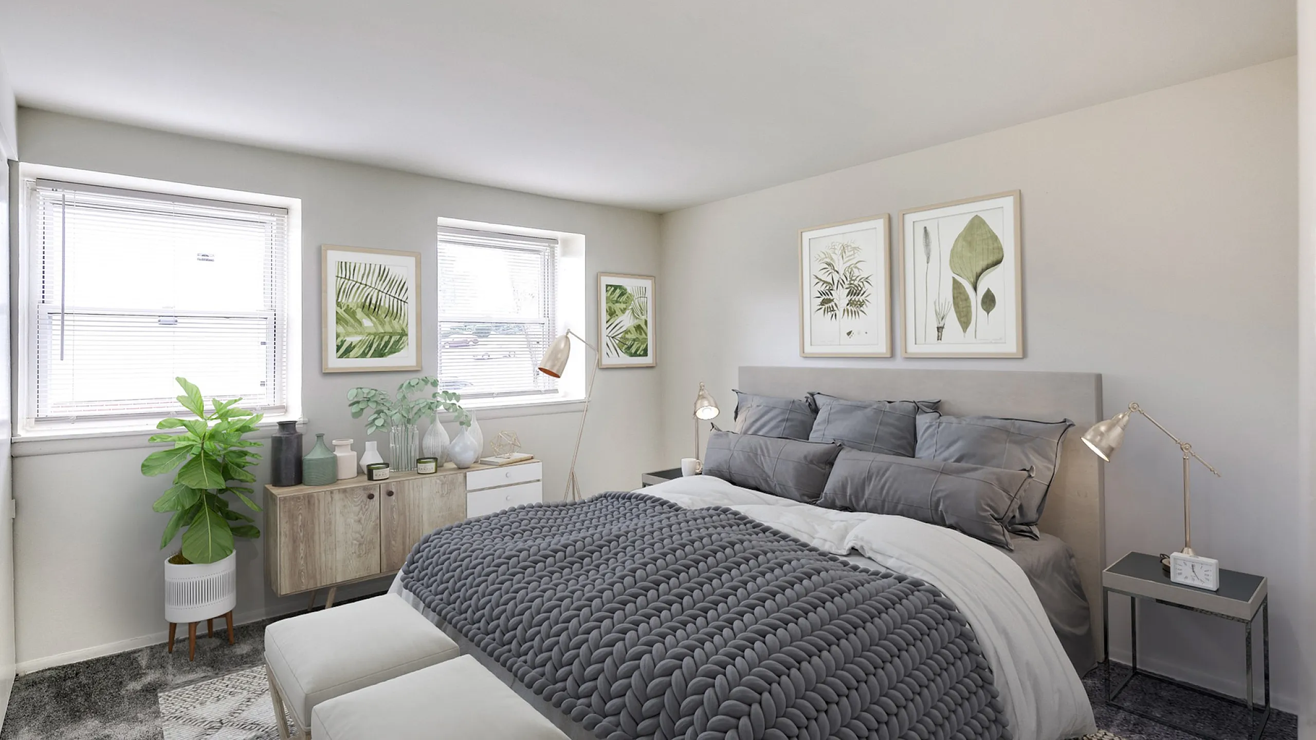 Bright and cozy bedroom featuring modern decor, a plush bed with a stylish knit throw, and large windows for natural light.