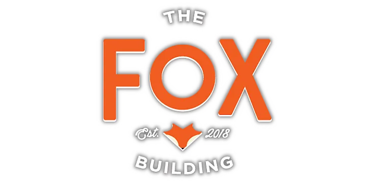 The Fox Building logo in vibrant orange, established in 2018, featuring a modern design and playful fox icon.