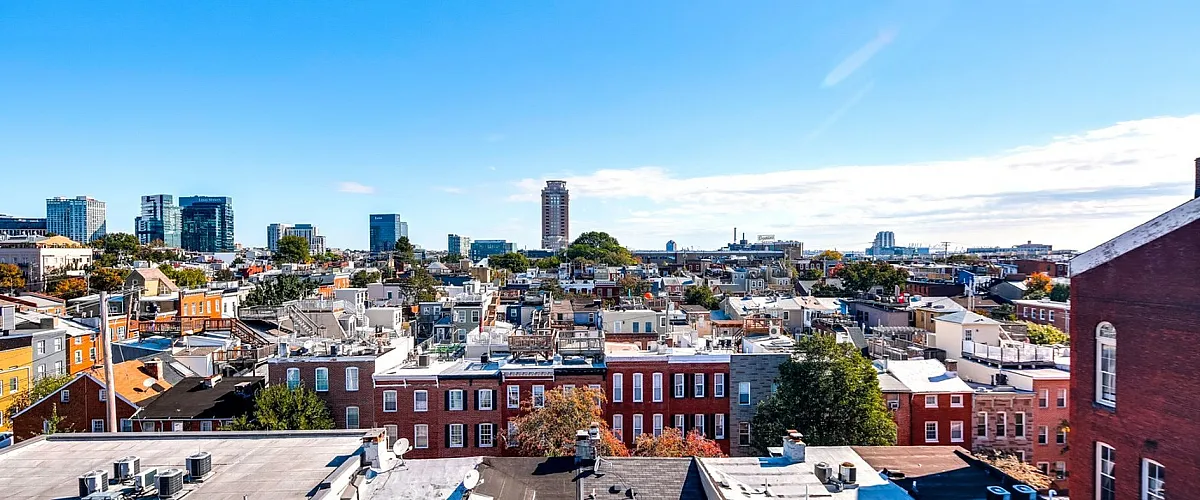 Breathtaking urban skyline view showcasing bustling city life and vibrant architecture under a clear blue sky.