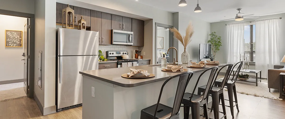 the yard on south main ann arbor model unit kitchen with appliances, island, stools