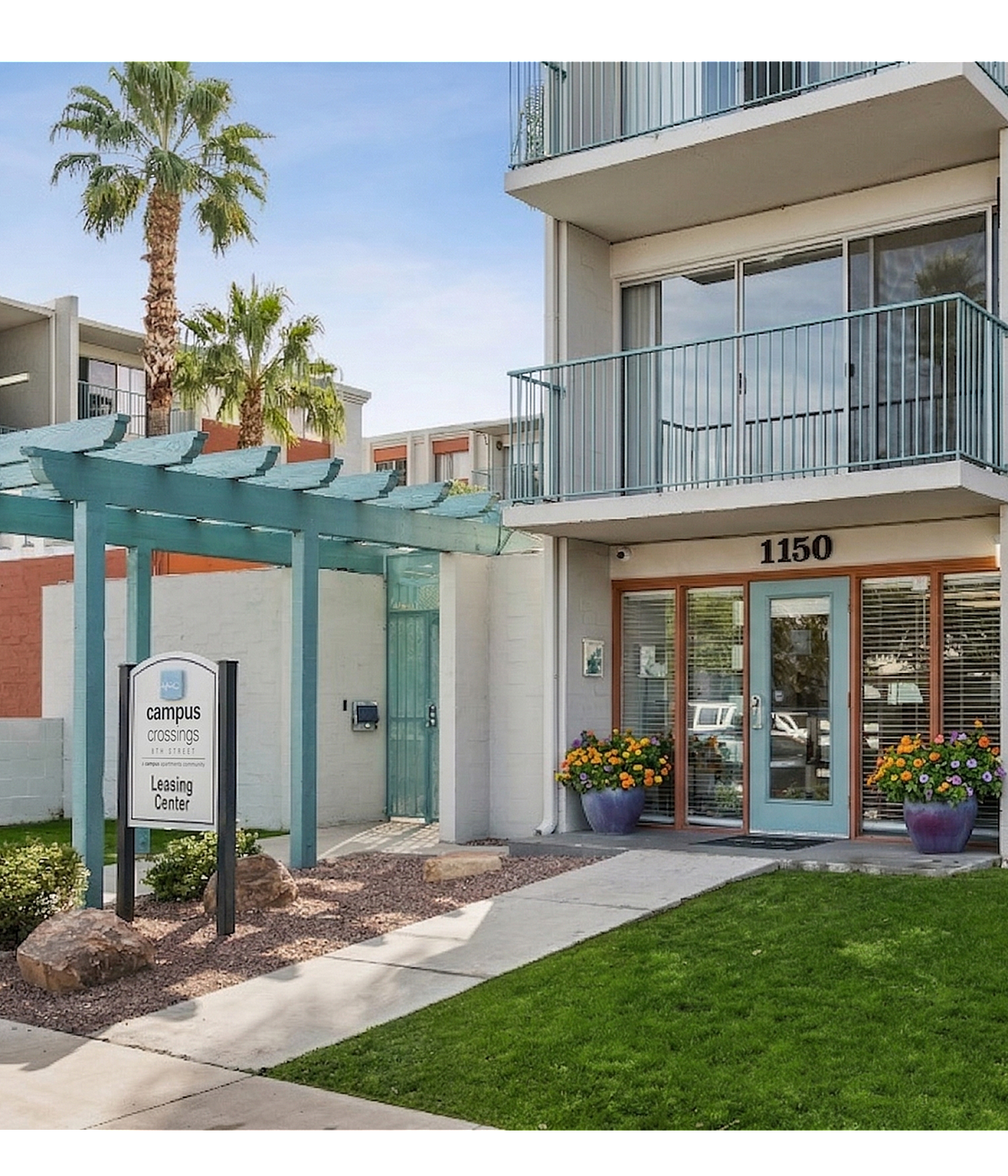 Inviting apartment exterior with modern design, vibrant greenery, and welcoming entrance at Campus Crossings leasing center.