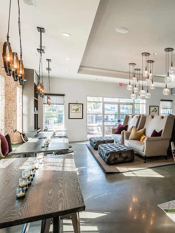 Elegant lounge area featuring contemporary design with plush seating, stylish lighting, and ample natural light.