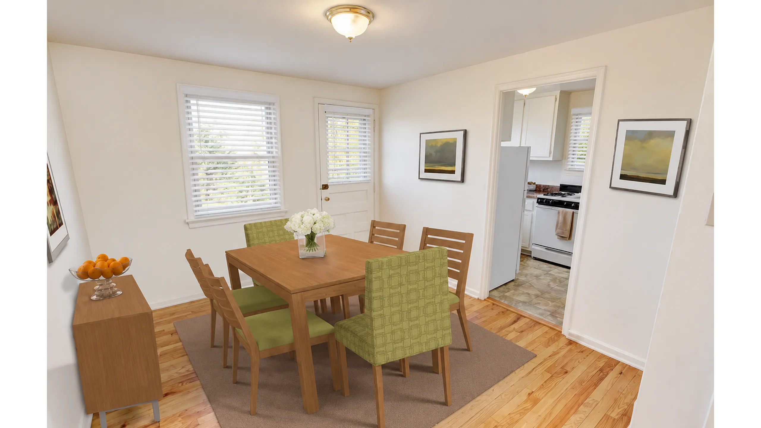 Sunlit dining area with hardwood floors and faux-wood blinds at Adams Park Apartments