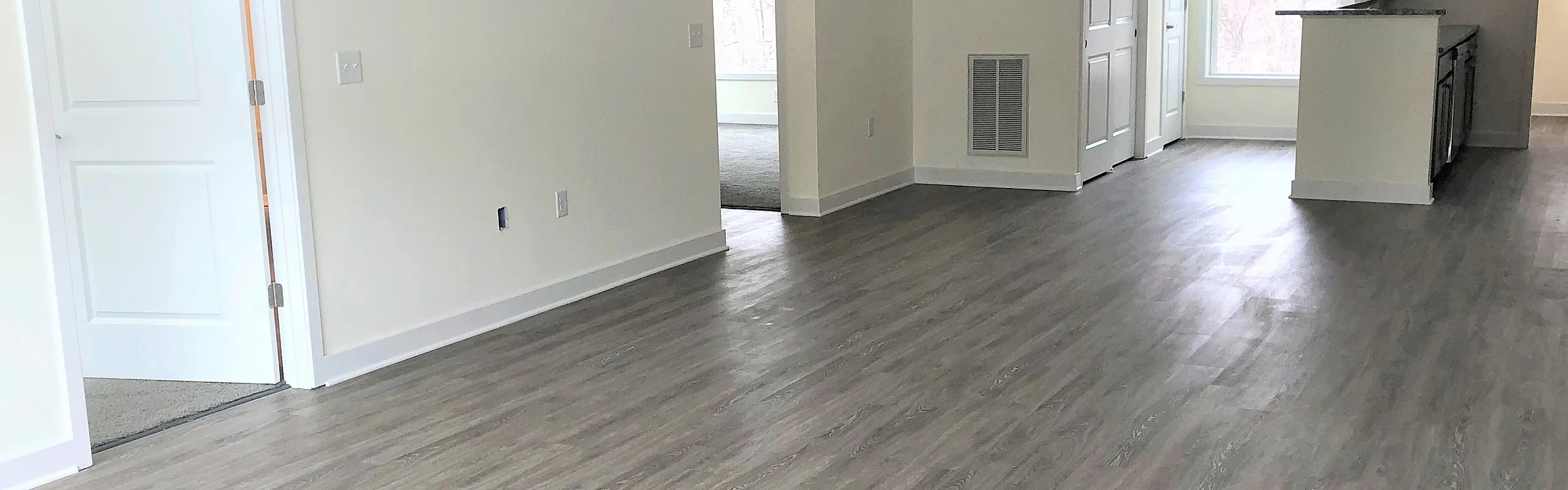 Open-plan living and kitchen area at Sunrise Solars Apartments in Latham, NY