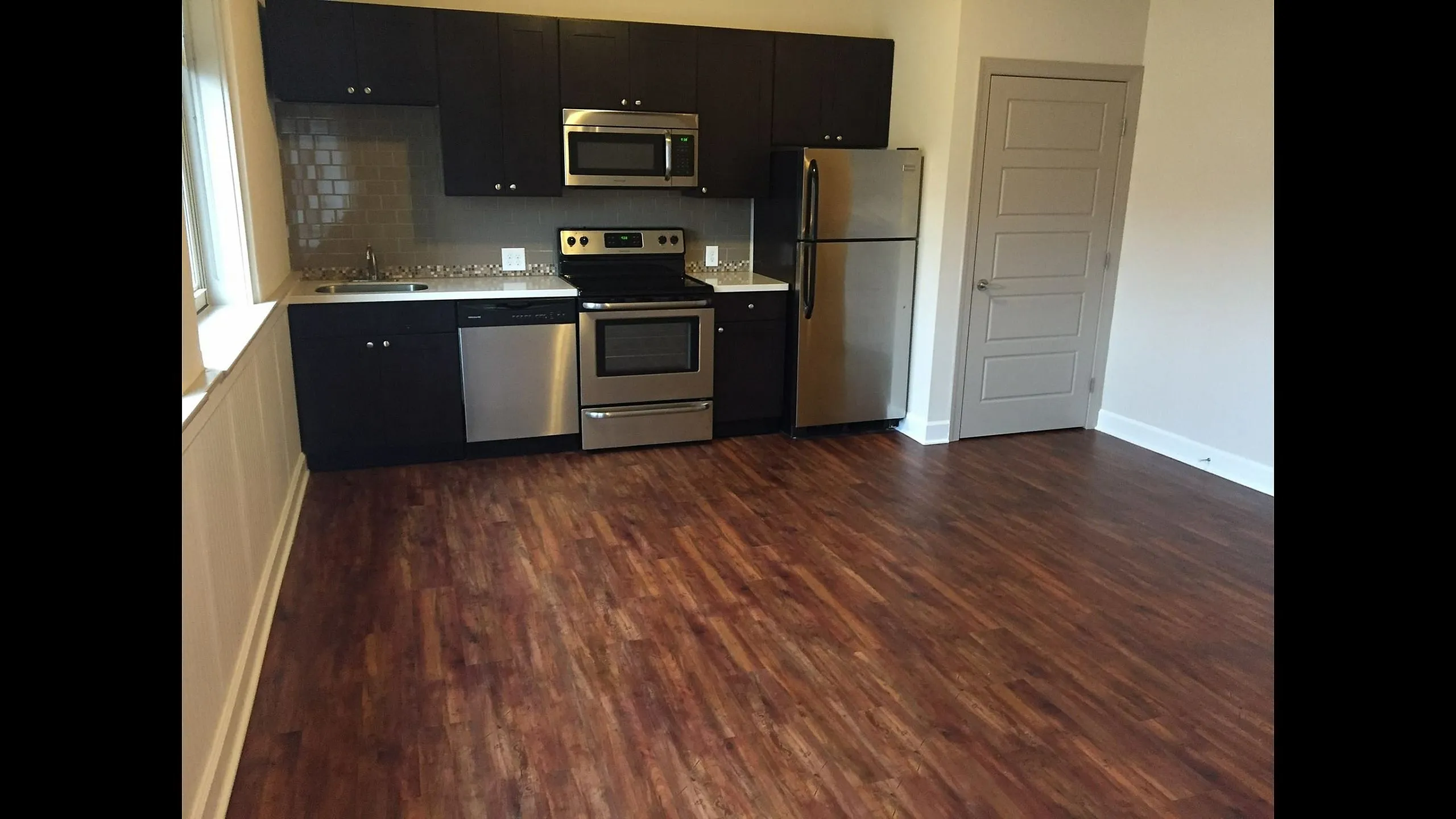 Loft kitchen with full-size appliances at Homeroom Lofts