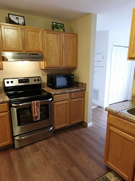 Renovated kitchen with stainless steel appliances at Long Pond Village Apartments in Schenectady, NY