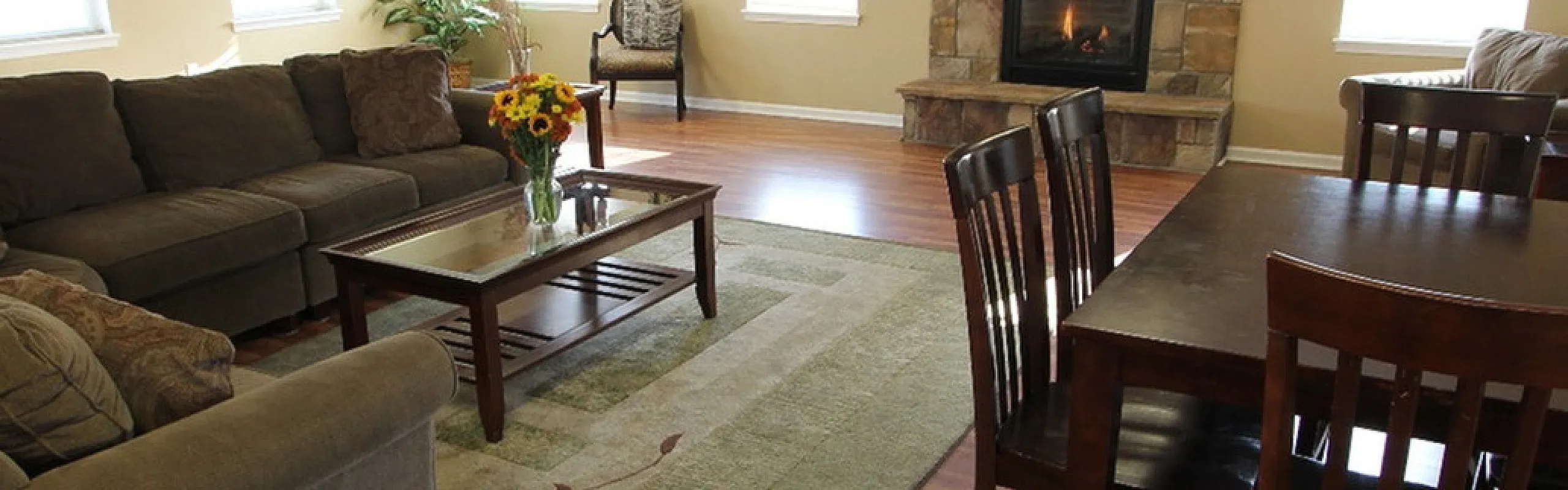 Clubhouse lounge with fireplace and comfortable seating at Long Pond Village Apartments in Schenectady, NY
