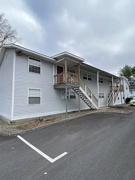 Private entrance and exterior stairway at Canfield Apartments in Gansevoort, NY