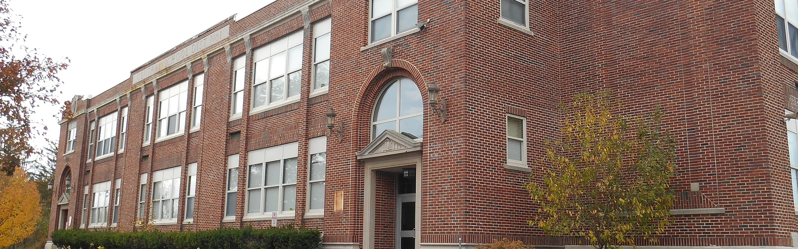 Front entrance of the converted brick schoolhouse at Homeroom Lofts in Averill Park, NY
