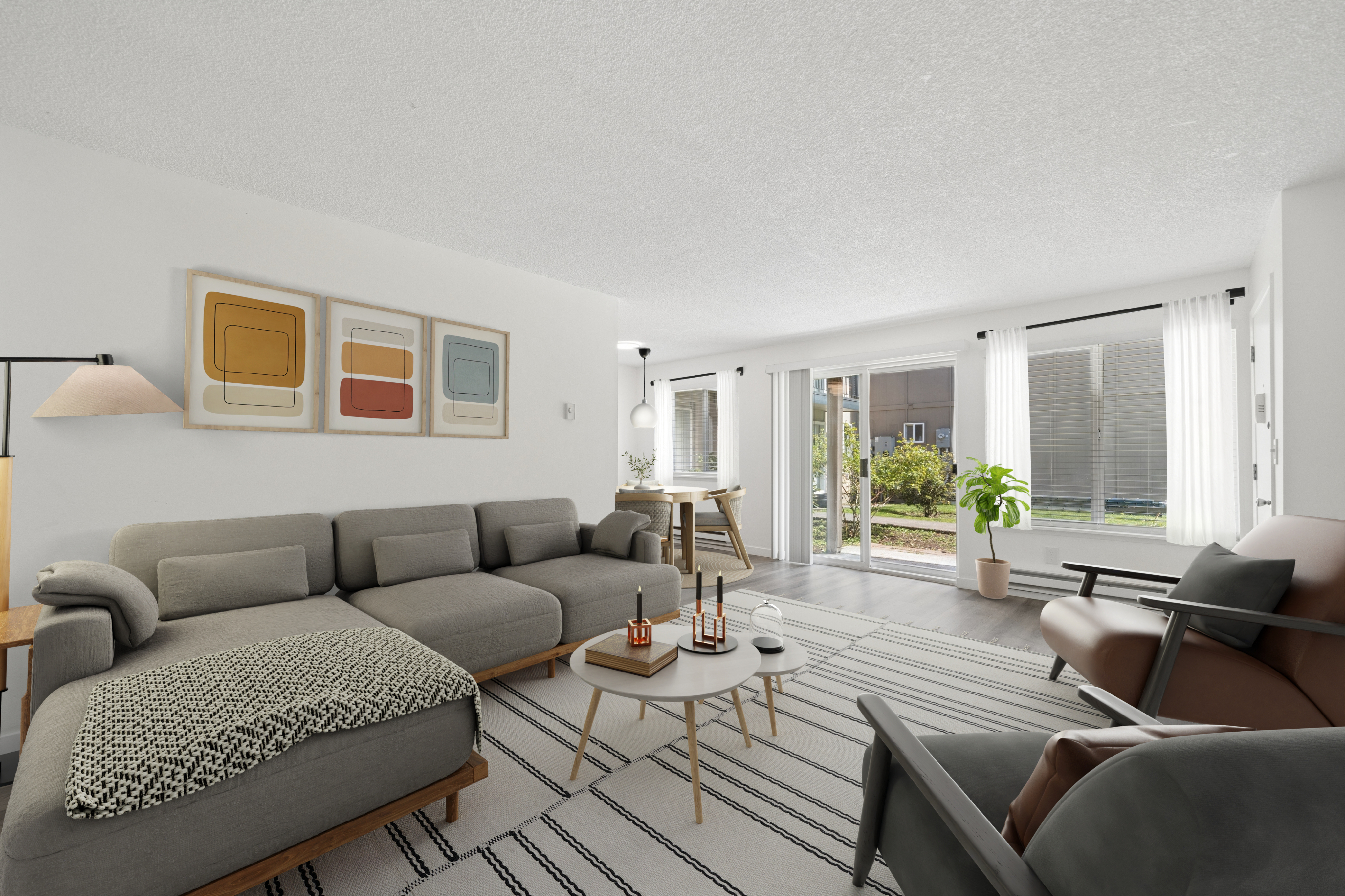Bright and stylish living room LVP flooring, bright windows and easy access to patio/exterior..