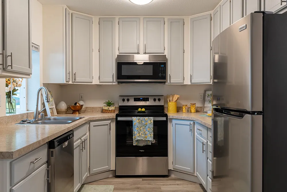 Stylish kitchen with modern appliances, sleek countertops, and ample cabinetry.
