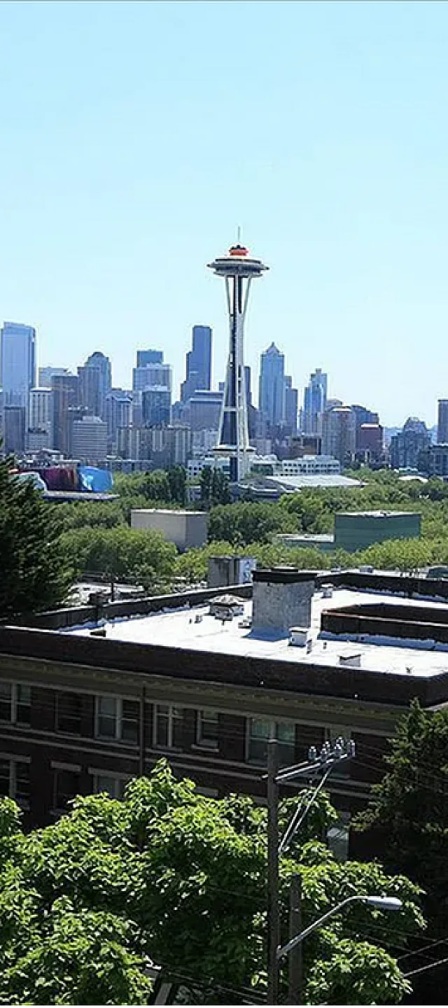 Breathtaking cityscape view featuring iconic architecture and vibrant urban life against a clear blue sky.