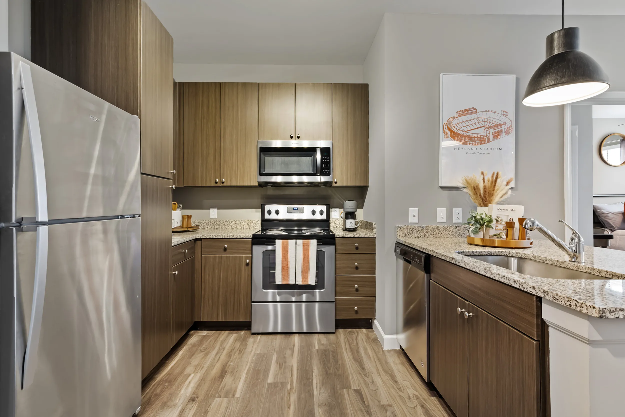 303 Flats apartment kitchen featuring premium stainless steel appliances in Knoxville Tennessee student housing