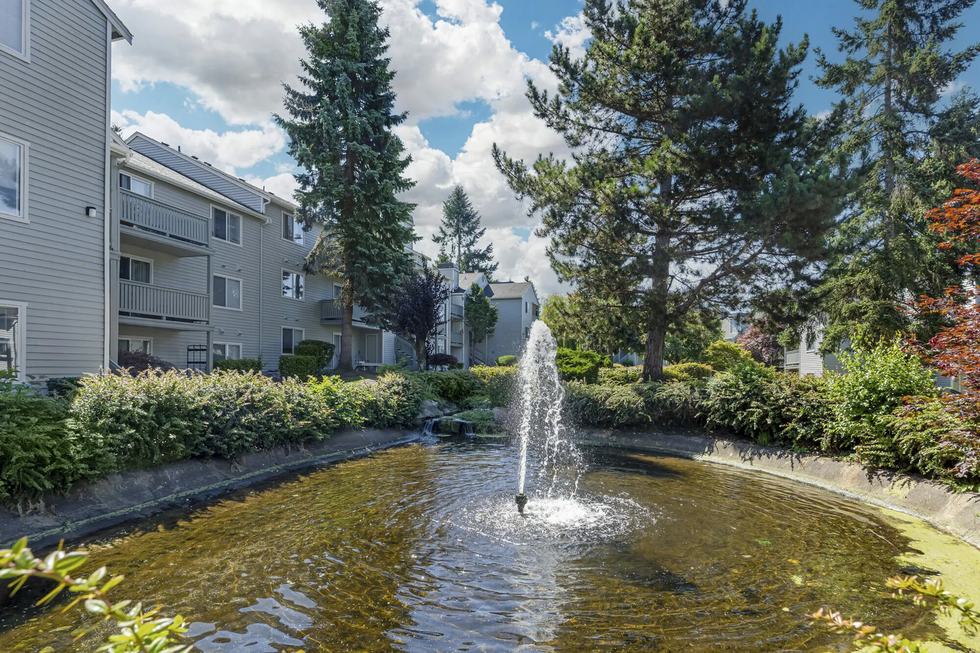 Beautiful ponds and fountains landscaping at Canyon Springs apartments in Lynnwood, WA