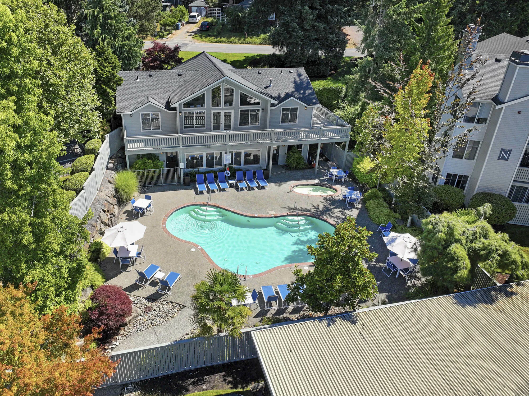 Resort-style swimming pool at Canyon Springs apartment community in Lynnwood, WA