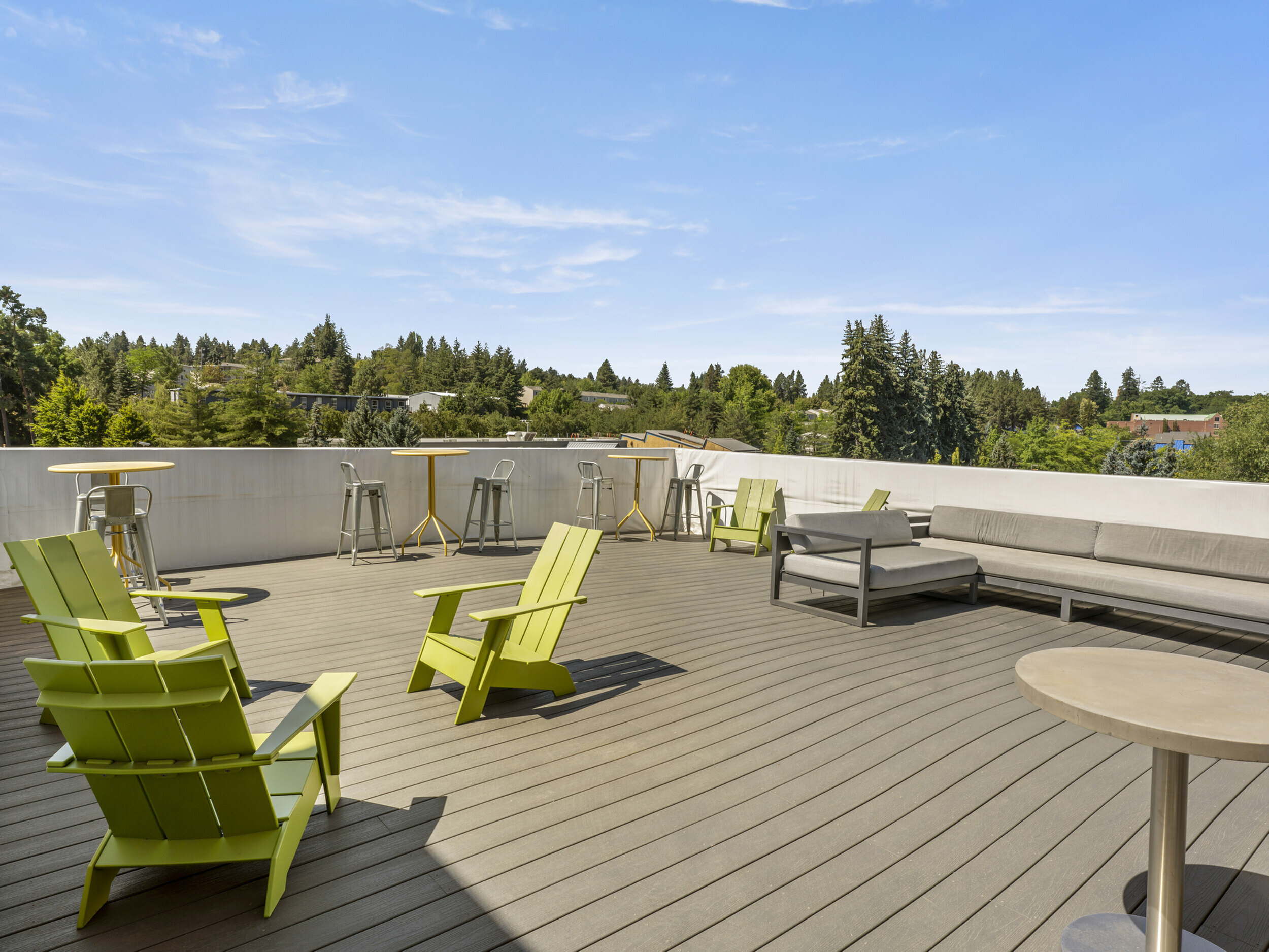 Republic on Main in Moscow, ID outdoor rooftop deck and community space with lounge seating and tables.