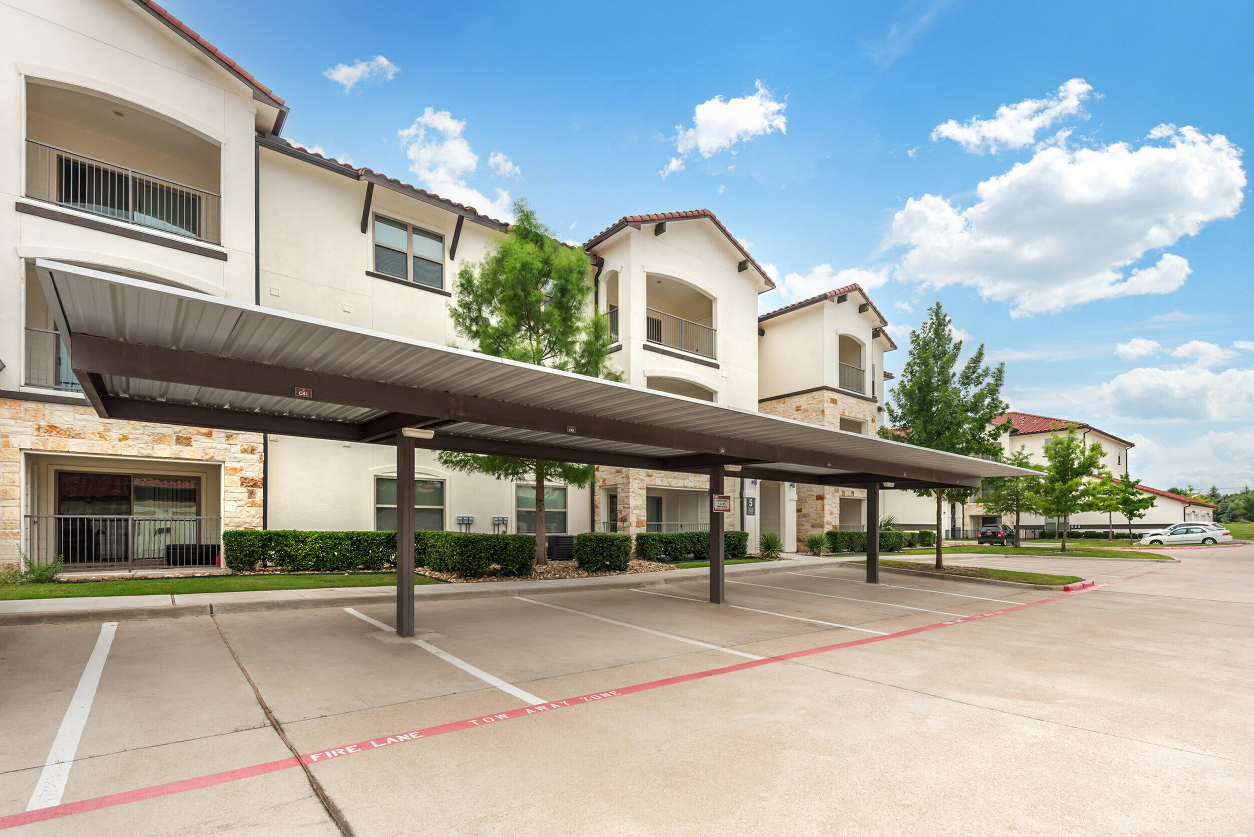 Covered Carport Parking at Stone Hill Apartments in Pflugerville, TX