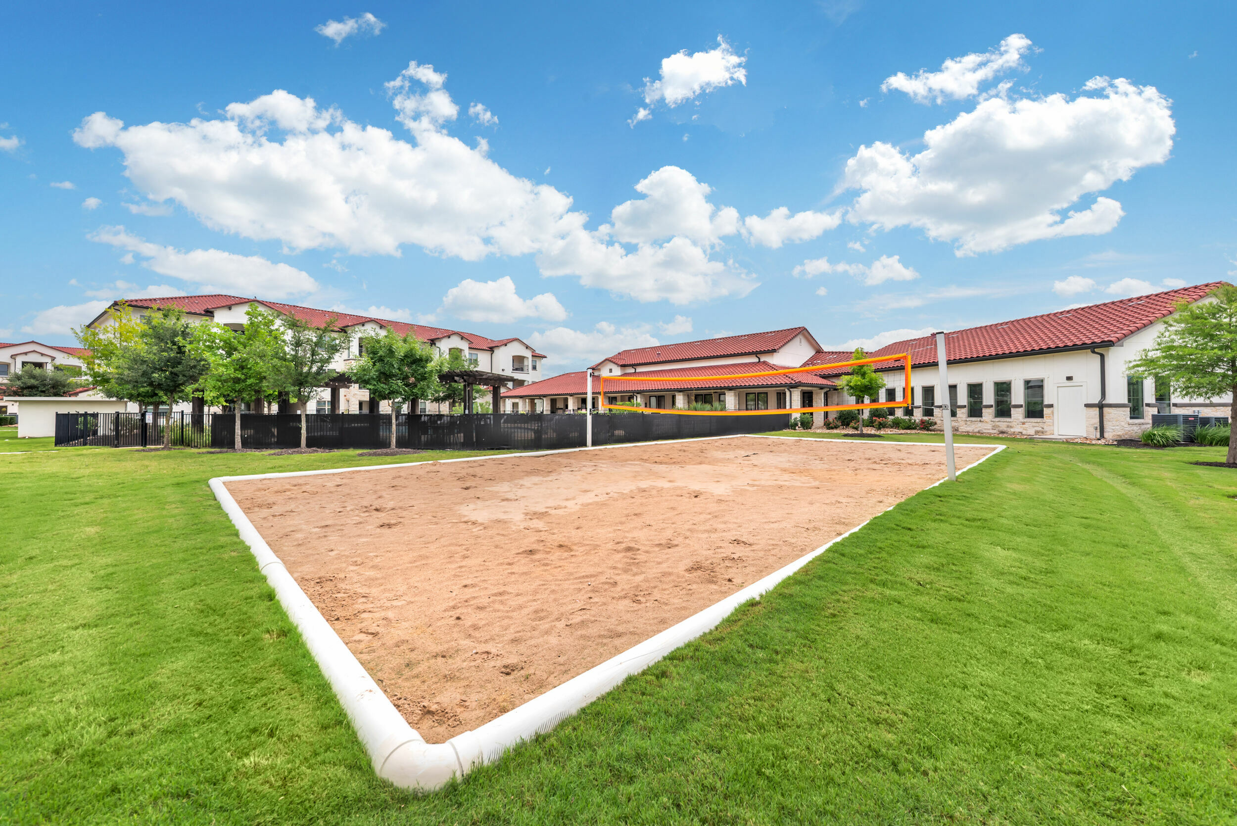 Sand Volleyball Court at Stone Hill Apartments in Pflugerville, TX