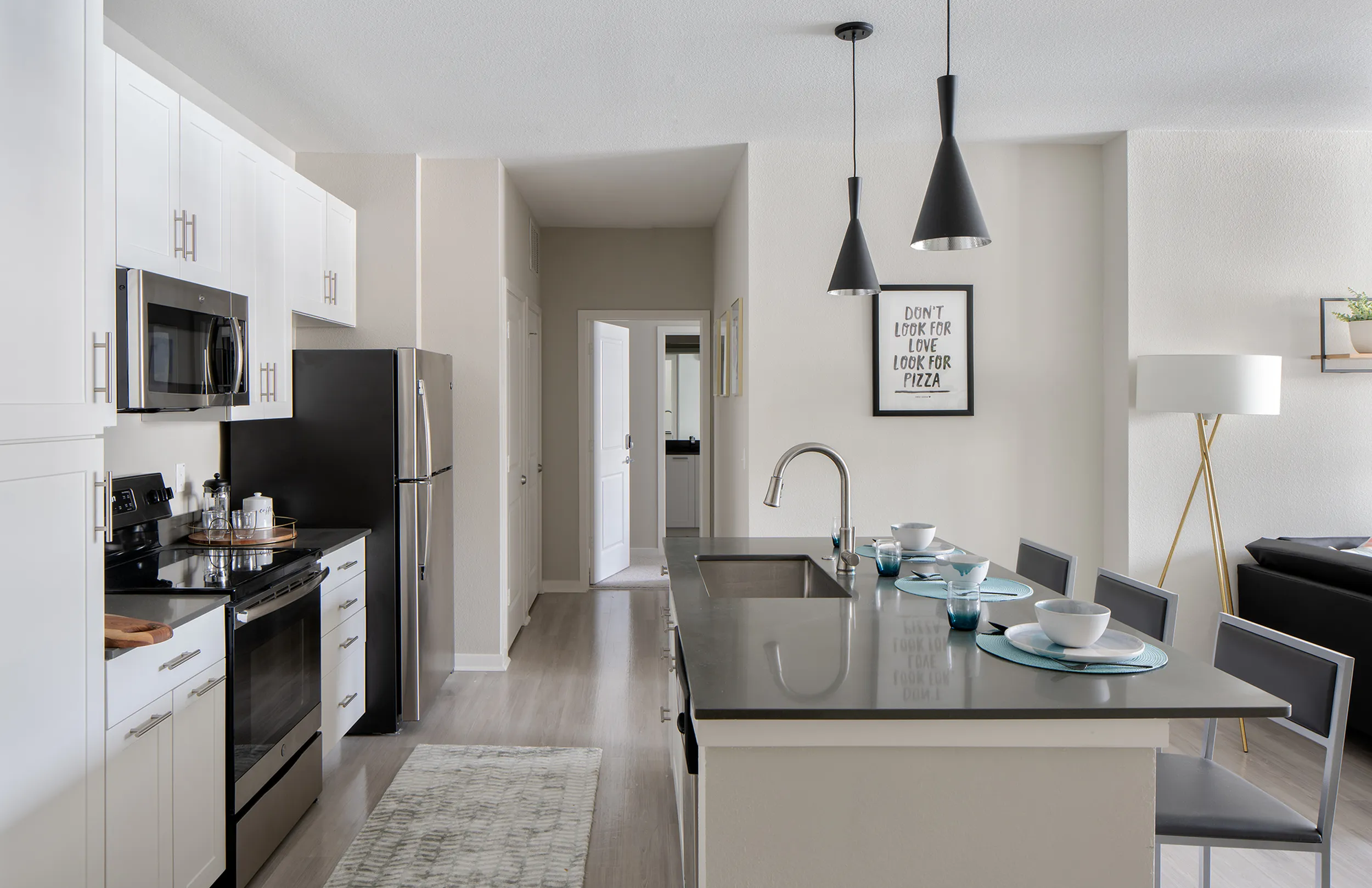 Campus Circle Gainesville apartment kitchen featuring stainless steel appliances near University of Florida in Gainesville FL