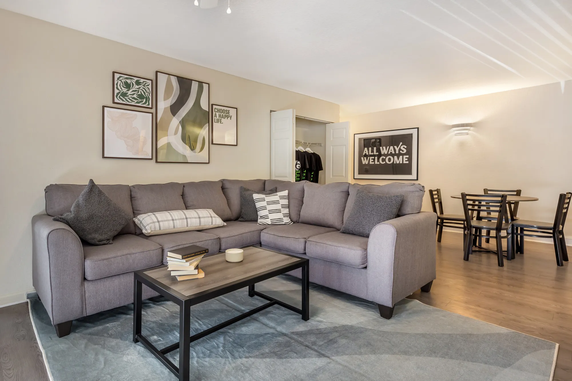 Comfortable sectional sofa in furnished living room at Village Green NCSU student housing in Raleigh NC