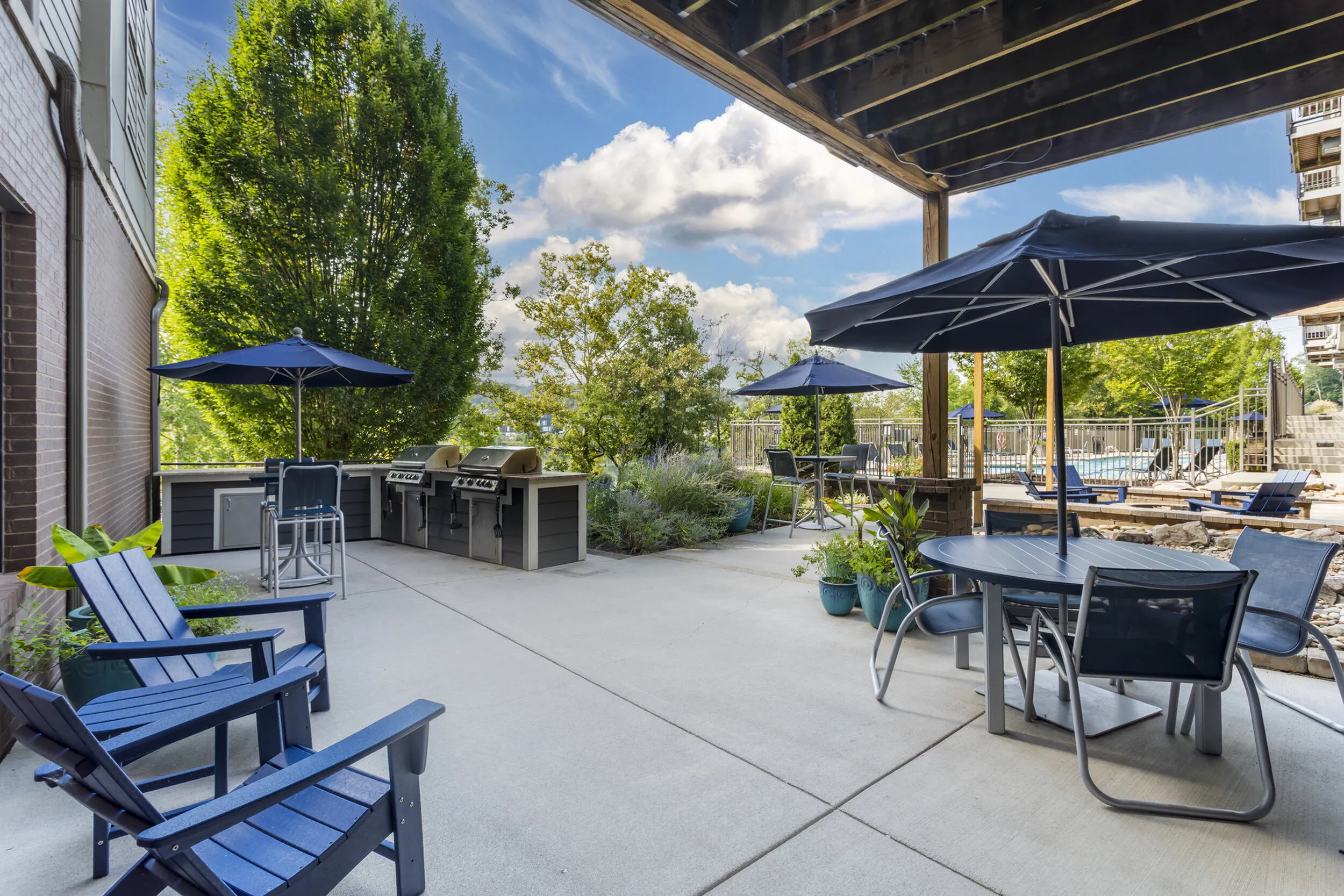 Outdoor BBQ grills and shaded picnic area for resident entertaining at The Landings Knoxville TN