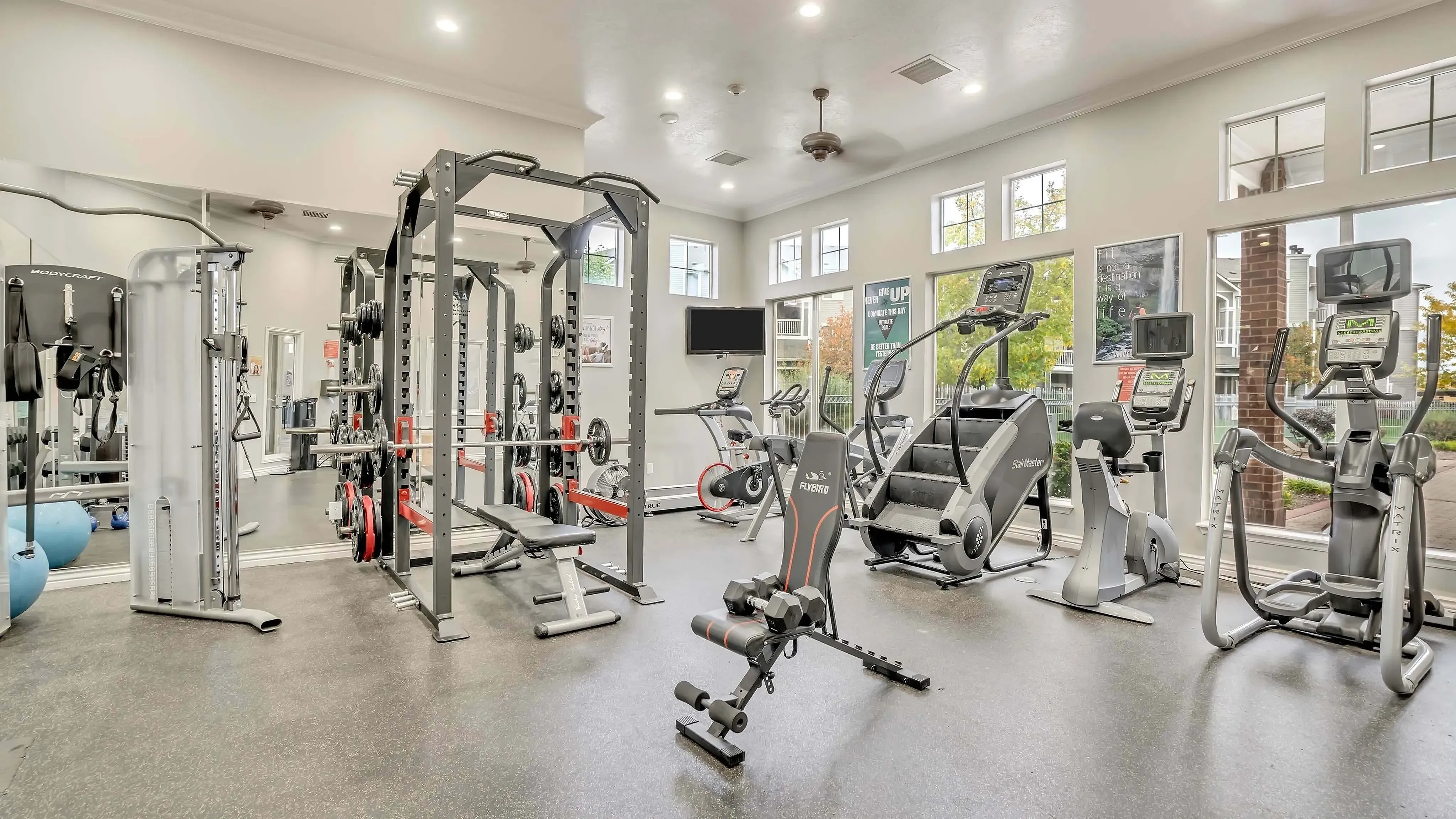 Fitness center at Pinnacle Mountain View apartments in Clearfield, UT