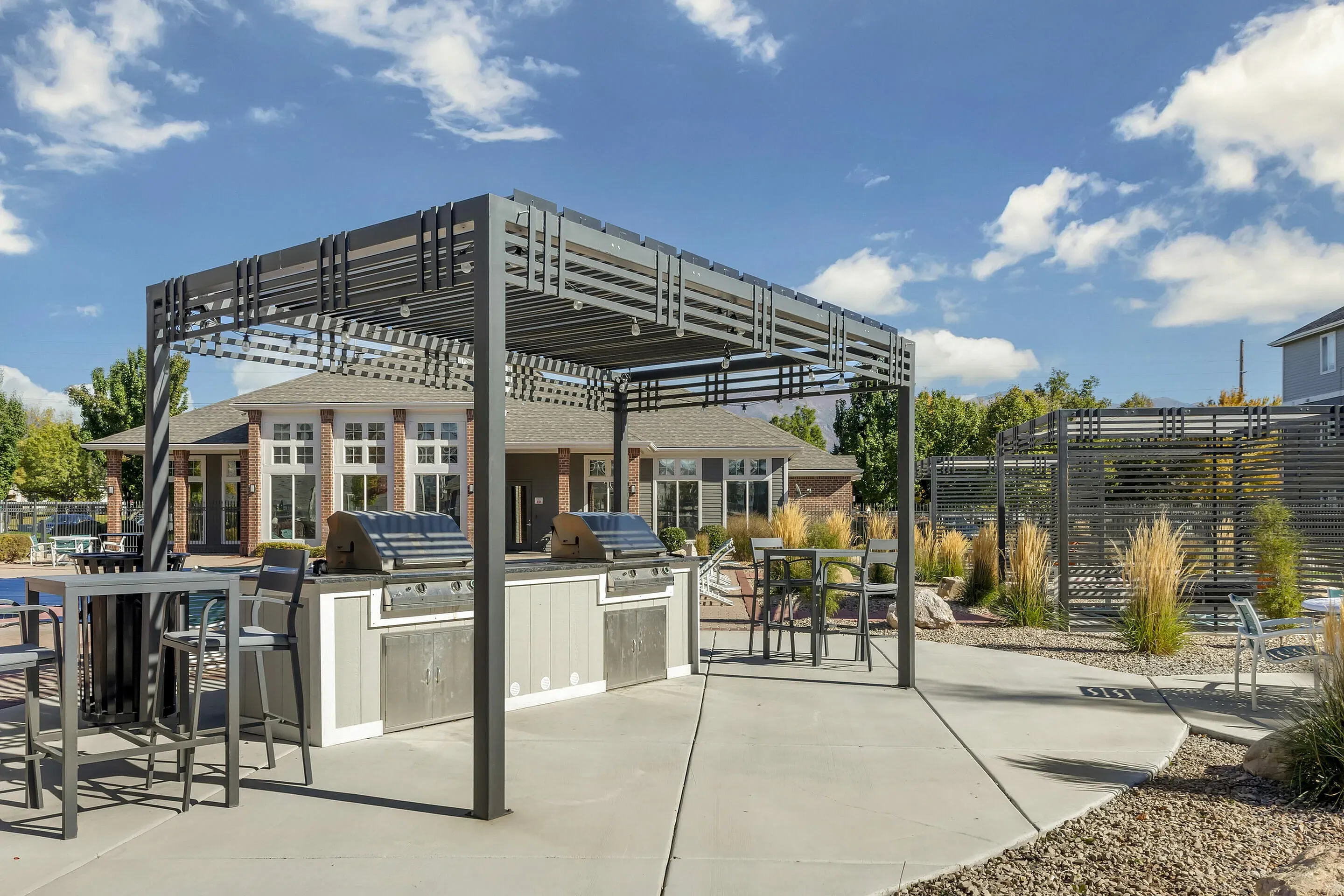 BBQ grills and picnic area at Pinnacle Mountain View apartments in Clearfield, UT