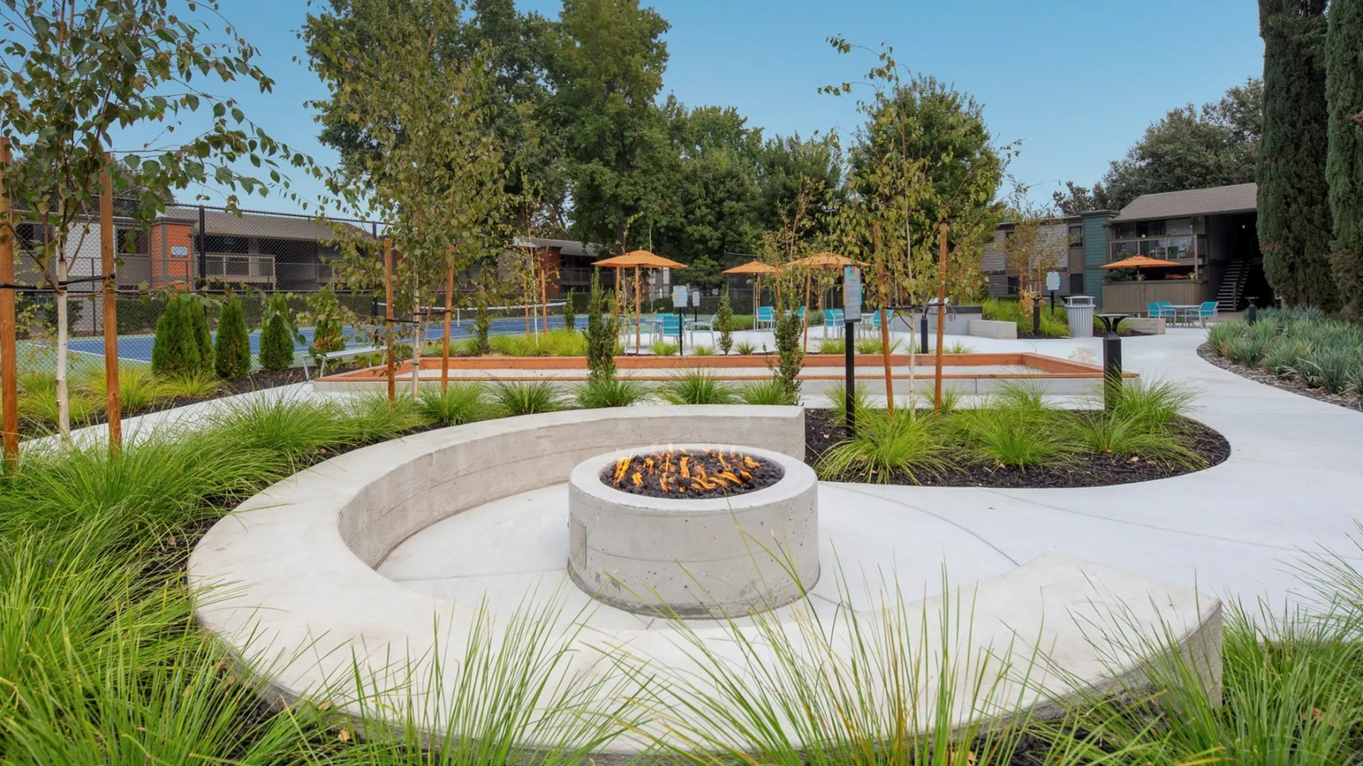 Outdoor fire pit and lounge area at Apex on the River apartments in Sacramento, CA