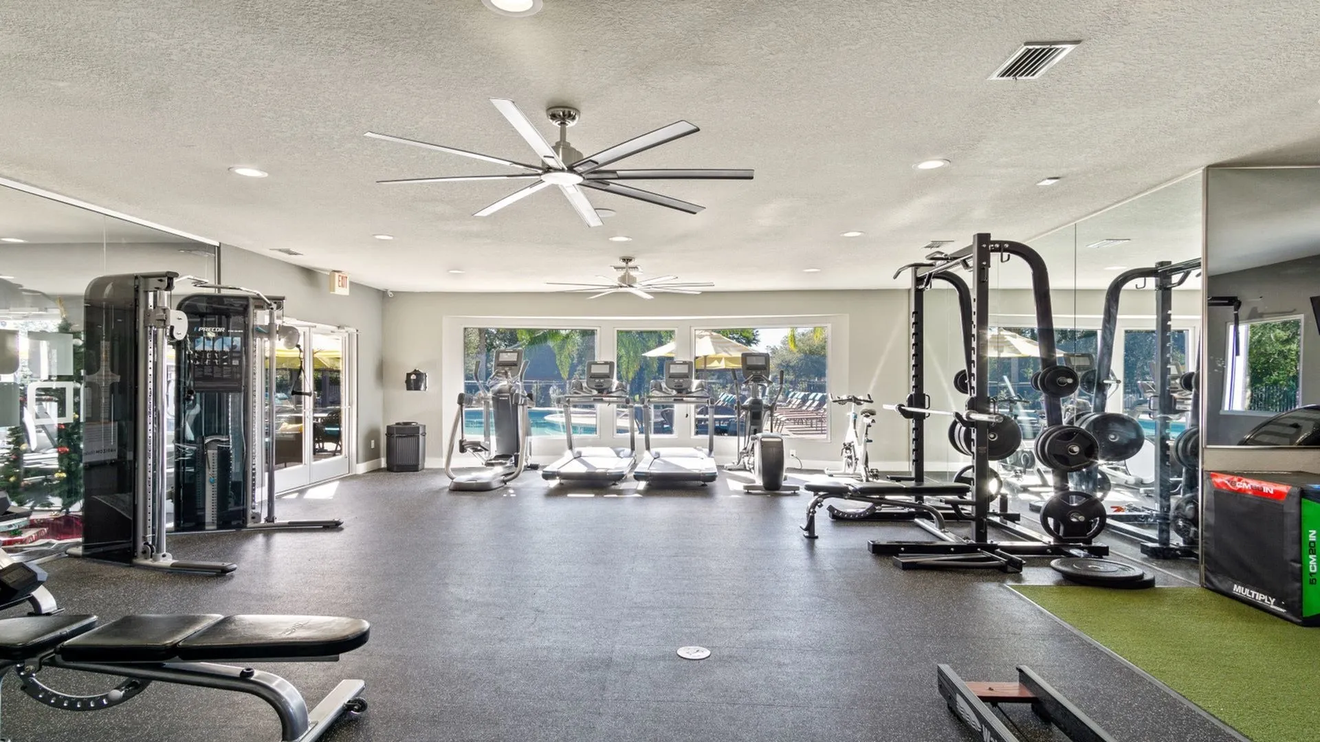 The Quad fitness center with free weights and exercise equipment.
