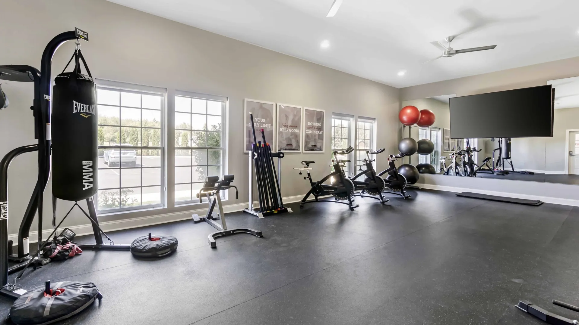 Fitness center with punching bag and open workout floor at The Verge student apartments in Ellensburg, Washington