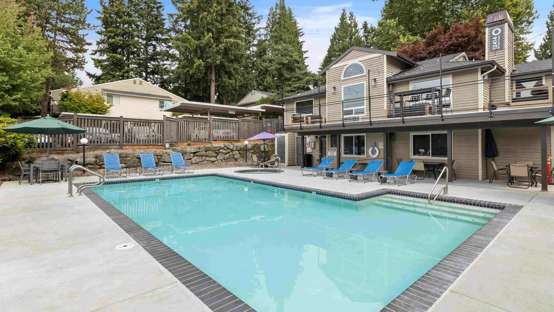Outdoor seasonal pool with heated spa at Totem Lake Heights apartments in Kirkland, Washington